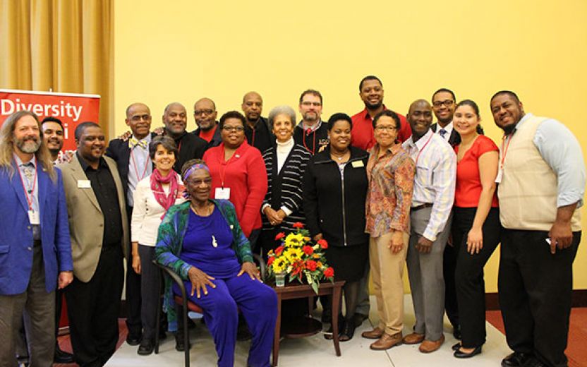 Group of faculty, staff, students, and alumni with Gloria Joseph sitting on a chair in the middle at the Africana Center Multipurpose Room/Cornell at the 50th anniversary of COSEP celebration