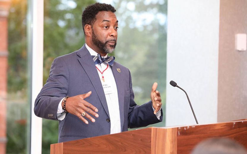 HEOP Alumni Ernest Eric Elmore Class of 1986, JD Class of 1989 speaking at podium in the Statler Ballroom on Cornell University’s Campus as the keynote for the Cornell University EOP/HEOP 50th Anniversary Celebration in October 2019