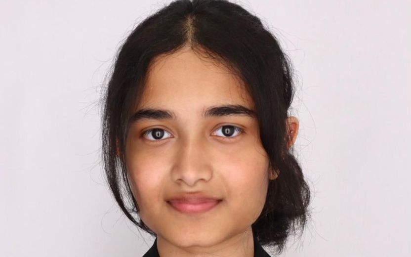 Soha Khan is looking at the camera. She has on professional clothes