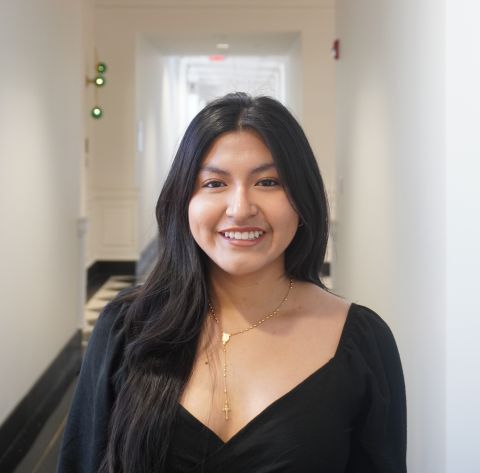 Litzy Puma is smiling at the camera