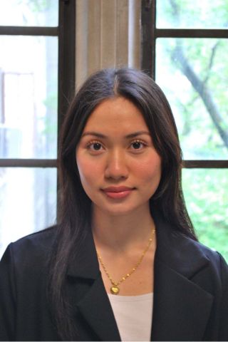 Hser Paw is smiling at the camera. She has on a black blazer over a white shirt