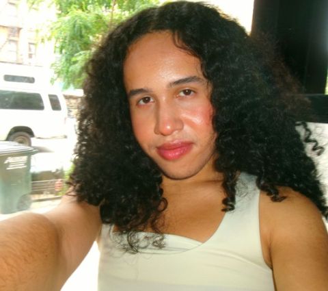 Prince Rodriguez is looking at the camera with a smile on his face