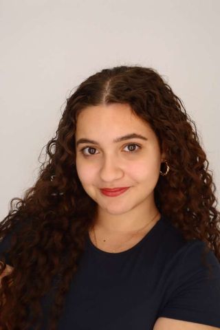 Besiness is smiling at the camera