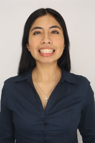 Dana Taboada is smiling at the camera