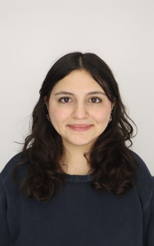 Tuana is smiling at the camera