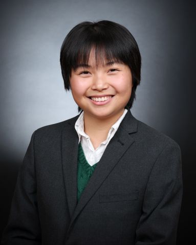 Annie Chen is smiling at the camera