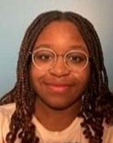 Kiara Jones is smiling at the camera