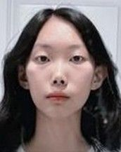 Rowan Tian is looking at the camera with a serious face