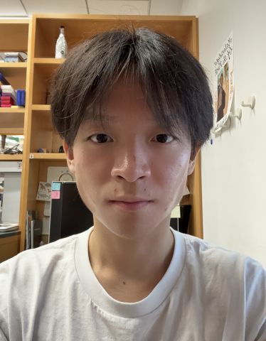 Eric Chen is looking at the camera