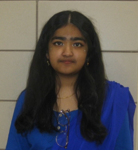 Shamonti Shamim is looking at camera and wearing a blue shirt