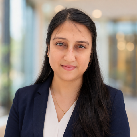 Bhaswati Sarmah is smiling at the camera. She has on professional clothes